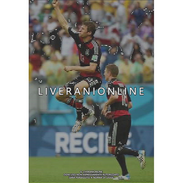 (140626) -- RECIFE, June 26, 2014 () -- Germany\'s Thomas Muller (L) celebrates for scoring a goal during a Group G match between the U.S. and Germany of 2014 FIFA World Cup at the Arena Pernambuco Stadium in Recife, Brazil, on June 26, 2014.(/Guo Yong)(pcy) ©PHOTOHOT/Agenzia Aldo Liverani sas - ITALY ONLY - EDITORIAL USE ONLY