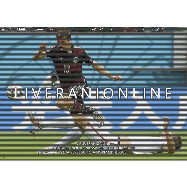 (140626) -- RECIFE, June 26, 2014 () -- Omar Gonzalez of the U.S. (R) tackles the ball controlled by Germany\'s Thomas Muller during a Group G match between the U.S. and Germany of 2014 FIFA World Cup at the Arena Pernambuco Stadium in Recife, Brazil, on June 26, 2014.(/Lui Siu Wai)(pcy) ©PHOTOHOT/Agenzia Aldo Liverani sas - ITALY ONLY - EDITORIAL USE ONLY