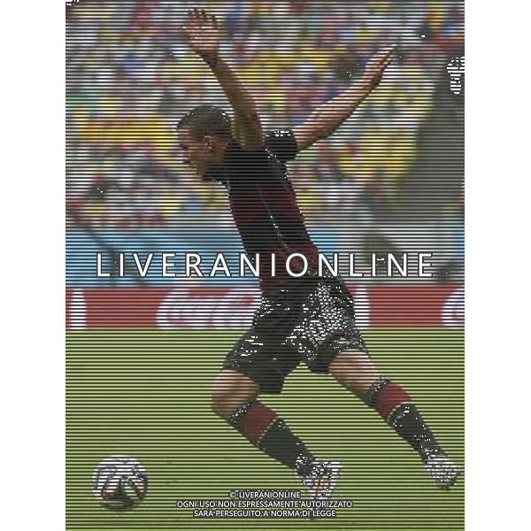 (140626) -- RECIFE, June 26, 2014 () -- Germany\'s Lukas Podolski controls the ball during a Group G match between the U.S. and Germany of 2014 FIFA World Cup at the Arena Pernambuco Stadium in Recife, Brazil, on June 26, 2014.(/Lui Siu Wai)(pcy) ©PHOTOHOT/Agenzia Aldo Liverani sas - ITALY ONLY - EDITORIAL USE ONLY
