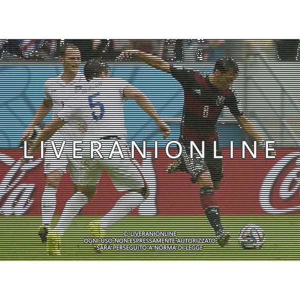 (140626) -- RECIFE, June 26, 2014 () -- Germany\'s Mesut Ozil (R) passes the ball during a Group G match between the U.S. and Germany of 2014 FIFA World Cup at the Arena Pernambuco Stadium in Recife, Brazil, on June 26, 2014.(/Lui Siu Wai)(pcy) ©PHOTOHOT/Agenzia Aldo Liverani sas - ITALY ONLY - EDITORIAL USE ONLY