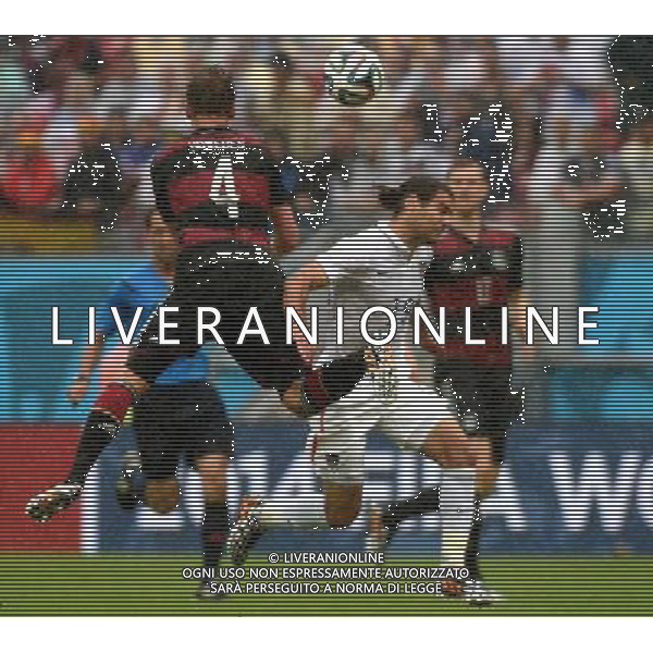 (140626) -- RECIFE, June 26, 2014 () -- Germany\'s Benedikt Howedes (L, front) vies with Graham Zusi of the U.S. during a Group G match between the U.S. and Germany of 2014 FIFA World Cup at the Arena Pernambuco Stadium in Recife, Brazil, on June 26, 2014.(/Guo Yong)(pcy) ©PHOTOHOT/Agenzia Aldo Liverani sas - ITALY ONLY - EDITORIAL USE ONLY
