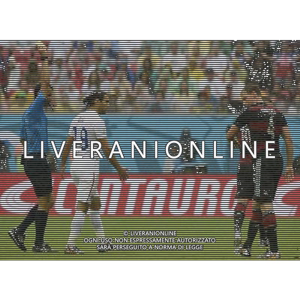 (140626) -- RECIFE, June 26, 2014 () -- Uzbiekistan\'s referee Ravshan Irmatov (1st L) gives a yellow card to Germany\'s Benedikt Howedes (1st R) during a Group G match between the U.S. and Germany of 2014 FIFA World Cup at the Arena Pernambuco Stadium in Recife, Brazil, on June 26, 2014.(/Lui Siu Wai)(pcy) ©PHOTOHOT/Agenzia Aldo Liverani sas - ITALY ONLY - EDITORIAL USE ONLY