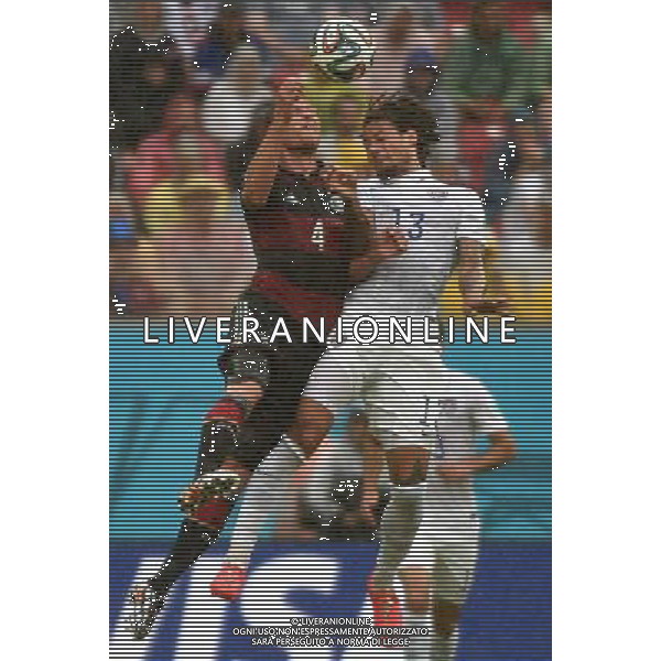 (140626) -- RECIFE, June 26, 2014 () -- Germany\'s Benedikt Howedes (L) competes for a header with Jermaine Jones of the U.S. during a Group G match between the U.S. and Germany of 2014 FIFA World Cup at the Arena Pernambuco Stadium in Recife, Brazil, on June 26, 2014.(/Guo Yong)(pcy) ©PHOTOHOT/Agenzia Aldo Liverani sas - ITALY ONLY - EDITORIAL USE ONLY