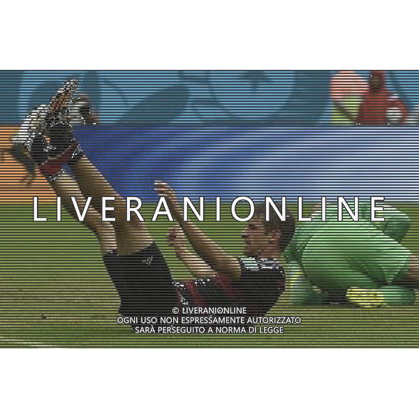 (140626) -- RECIFE, June 26, 2014 () -- Germany\'s Thomas Muller (L) falls down during a Group G match between the U.S. and Germany of 2014 FIFA World Cup at the Arena Pernambuco Stadium in Recife, Brazil, on June 26, 2014.(/Lui Siu Wai)(pcy) ©PHOTOHOT/Agenzia Aldo Liverani sas - ITALY ONLY - EDITORIAL USE ONLY