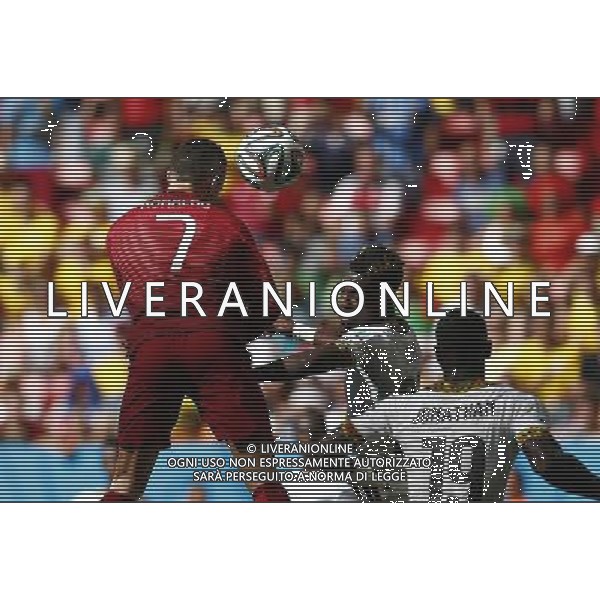 (140626) -- BRASILIA, June 26, 2014 () -- Portugal\'s Cristiano Ronaldo (L) jumps for a header during a Group G match between Portugal and Ghana of 2014 FIFA World Cup at the Estadio Nacional Stadium in Brasilia, Brazil, June 26, 2014. (/Liu Bin) ©photoshot/Agenzia Aldo Liverani sas - ITALY ONLY - EDITORIAL USE ONLY - PORTOGALLO GHANA CAMPIONATO DEL MONDO BRASILE 2014