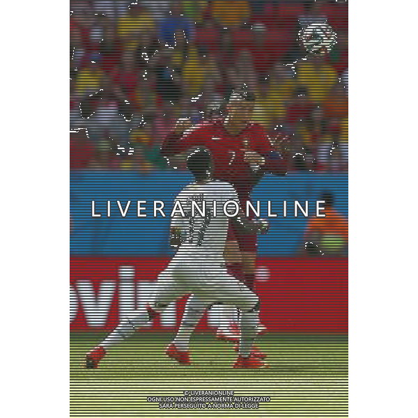 (140626) -- BRASILIA, June 26, 2014 () -- Portugal\'s Cristiano Ronaldo vies with Ghana\'s Mohammed Rabiu during a Group G match between Portugal and Ghana of 2014 FIFA World Cup at the Estadio Nacional Stadium in Brasilia, Brazil, June 26, 2014. (/Liu Bin) ©photoshot/Agenzia Aldo Liverani sas - ITALY ONLY - EDITORIAL USE ONLY - PORTOGALLO GHANA CAMPIONATO DEL MONDO BRASILE 2014