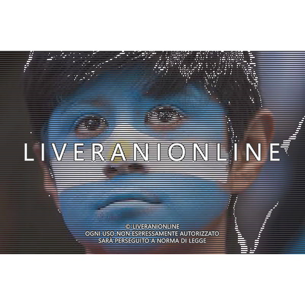 (140625) -- BUENOS AIRES, June 25, 2014 () -- An Argentina\'s fan reacts while watching the broadcast of a Group F match between Argentina and Nigeria of 2014 FIFA World Cup on a screen installed in San Martin Square, Buenos Aires, Argentina, on June 25, 2014.(/Martin Zabala) (rh) ©PHOTOSHOT/Agenzia Aldo Liverani sas - ITALY ONLY - EDITORIAL USE ONLY