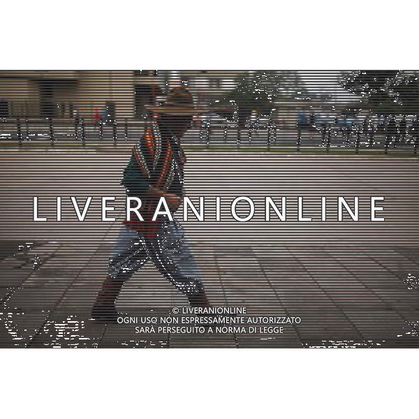 (140625) -- PORTO ALEGRE, June 25, 2014 () -- A gaucho man walks on a street in Porto Alegre, Brazil, on June 25, 2014. Gaucho, a word that is an equivalent of the North American \'cowboy\', are residents famed for their cowboy living style, found mainly in Argentina, Southern Brazil, Uruguay, Paraguay, eastern and southern Bolivia and Southern Chile. (/Jhon Paz) (rh) ©PHOTOSHOT/Agenzia Aldo Liverani sas - ITALY ONLY - EDITORIAL USE ONLY