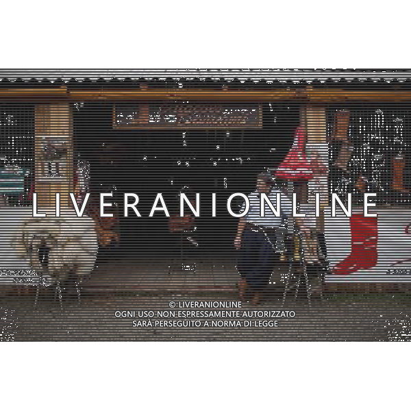 (140625) -- PORTO ALEGRE, June 25, 2014 () -- A gaucho boot saleman is seen in front of his store in Porto Alegre, Brazil, on June 25, 2014. Gaucho, a word that is an equivalent of the North American \'cowboy\', are residents famed for their cowboy living style, found mainly in Argentina, Southern Brazil, Uruguay, Paraguay, eastern and southern Bolivia and Southern Chile. (/Jhon Paz) (rh) ©PHOTOSHOT/Agenzia Aldo Liverani sas - ITALY ONLY - EDITORIAL USE ONLY