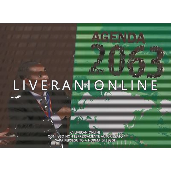 (140624) -- MALABO, June 24, 2014 () -- A man arranges an \'African Union (AU) Agenda 2063\' poster at the venue of the 23rd Ordinary Session of the Assembly of the AU in Malabo, capital of Equatorial Guinea, June 24, 2014. The 23rd Ordinary Session of the Assembly of the AU will open here on Thursday with the theme of \'Agriculture and Food Security\'. (/Meng Chenguang) ©PHOTOSHOT/Agenzia Aldo Liverani sas - ITALY ONLY - EDITORIAL USE ONLY - VERTICE INFRASTRUTTURE a Malabo, capitale della Guinea Equatoriale, 25 giugno 2014 per lo sviluppo di progetti infrastrutturali che collegano i paesi africani e l\'integrazione regionale e di crescita condivisa