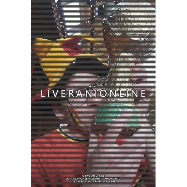 (140626) -- SAO PAULO, June 26, 2014 () -- A supporter of Belgium poses with a replica of FIFA World Cup Trophy as waiting for a train to the Arena Sao Paulo Stadium where a Group H match between Belgium and Korea Republic of 2014 FIFA World Cup is held, in Sao Paulo, Brazil, June 26, 2014.(/Rahel Patrasso)(pcy) ©PHOTOSHOT/Agenzia Aldo Liverani sas - ITALY ONLY - EDITORIAL USE ONLY - Corea del Sud Vs Belgio Coppa del Mondo 2014 partita del Gruppo H FIFA World Cup 2014 allo Stadio Arena di Sao Paulo, in Brasile, il 26 giugno 2014