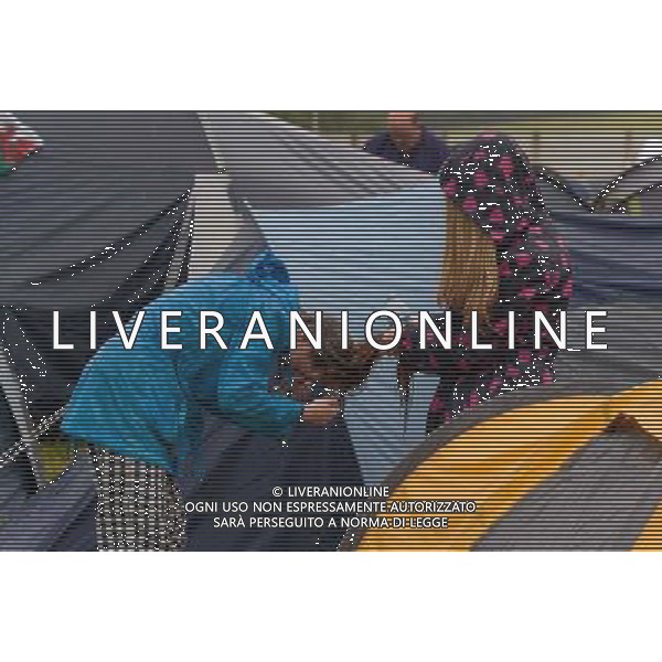Pilton, UK, 27/06/2014 : Atmosphere at Glastonbury Festival. The festival wakes up on a rainy morning. Picture by Julie Edwards AG ALDO LIVERANI SAS ONLY ITALY