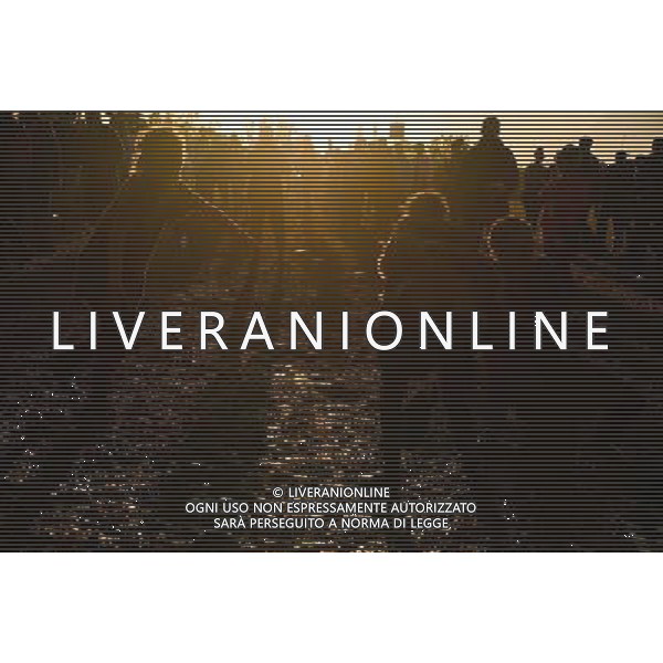 Pilton, UK, 27/06/2014 : Atmosphere at Glastonbury Festival. Dancing in the mud as the sun goes down at Arcadia. AG ALDO LIVERANI SAS ONLY ITALY