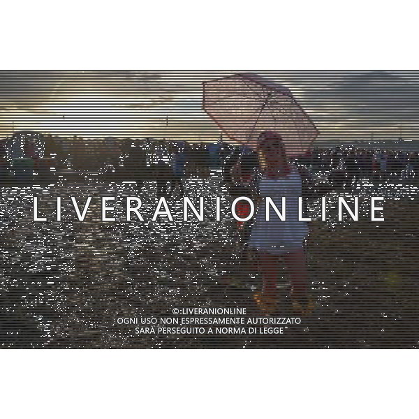 Pilton, UK, 27/06/2014 : Atmosphere at Glastonbury Festival. Wellington boots and fashion. AG ALDO LIVERANI SAS ONLY ITALY