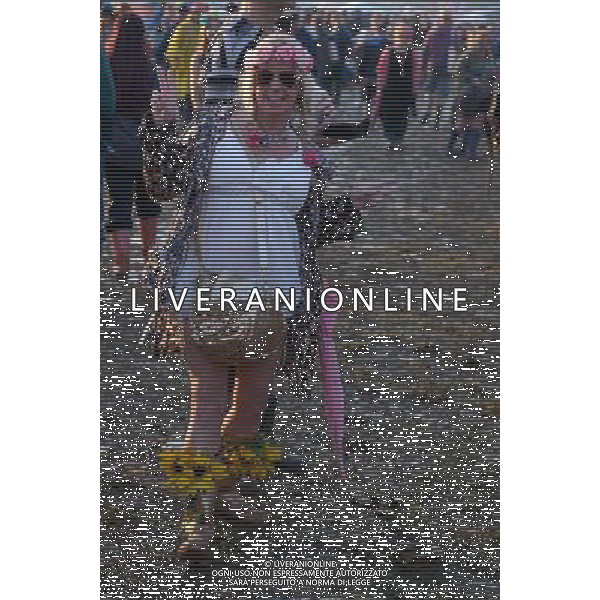 Pilton, UK, 27/06/2014 : Atmosphere at Glastonbury Festival. Wellington boots and fashion. AG ALDO LIVERANI SAS ONLY ITALY