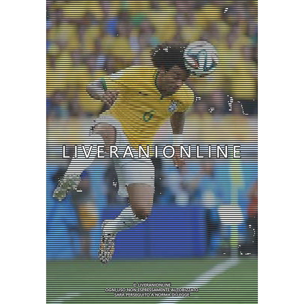 (140628) -- BELO HORIZONTE, June 28, 2014 () -- Brazil\'s Marcelo jumps fpr a header during a Round of 16 match between Brazil and Chile of 2014 FIFA World Cup at the Estadio Mineirao Stadium in Belo Horizonte, Brazil, on June 28, 2014. Brazil won 4-3 (3-2 in penalties) over Chile and qualified for Quarter-finals on Saturday.(/Liu Dawei)(rh) AG ALDO LIVERANI SAS ONLY ITALY