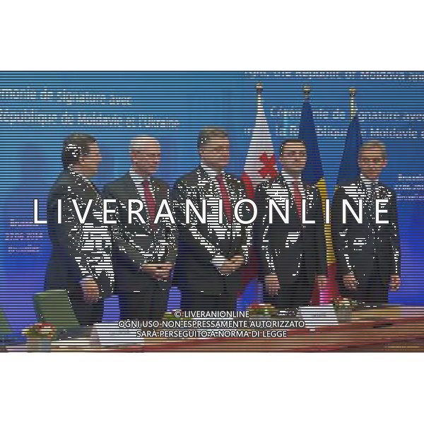 (140627) -- BRUSSELS, June 27, 2014 () -- (from L to R)European Union (EU) Commission President Jose Manuel Barosso, EU Council President Herman Van Rompuy, Ukrainian President Petro Poroshenko, Georgian Prime Minister Irakli Garibashvili and Moldova\'s Prime MInister Iurie Leanca are present at the signing ceremony, in Brussels, Belgium, June 27, 2014. The European Union (EU) signed the Association Agreements with Ukraine, Georgia and Moldova on Friday with the aim of deepening political and economic ties with the three former Soviet republics(/The Council of the European Union) (lyi) *NO COMMERCIAL USE* AG ALDO LIVERANI SAS ONLY ITALY