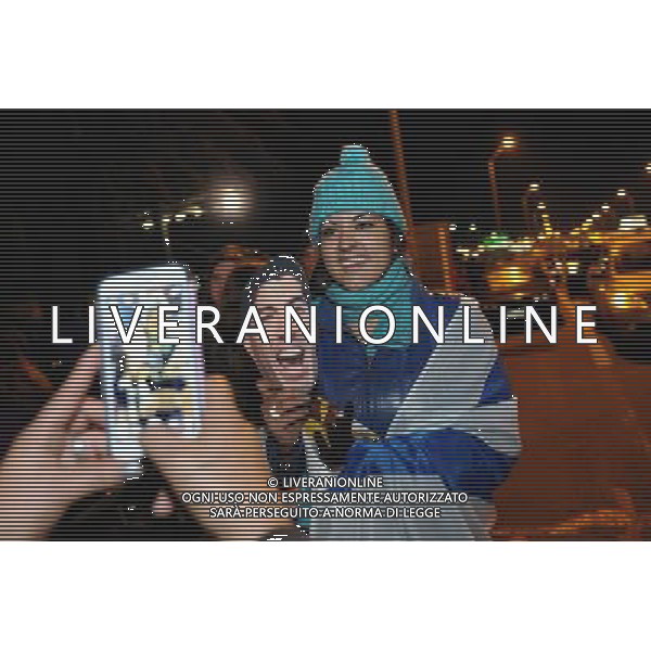 (140627) -- MONTEVIDEO, June 27, 2014 () -- Fans take pictures while waiting for the arrival of the Uruguay\'s National Team player, Luis Suarez in the Carrasco National Airport in Montevideo, capital of Uruguay on June 26, 2014. The Uruguay forward was banned by FIFA from all football for four months on Thursday for biting an Italian opponent in the first round match of 2014 FIFA World Cup. Uruguay will face Colombia on June 28, in FIFA World Cup Brazil 2014. (/Nicolas Celaya) ©PHOTOSHOT/Agenzia Aldo Liverani sas - ITALY ONLY - EDITORIAL USE ONLY - LUIS SUAREZ attaccante dell\'Uruguay e\' stato squalificato dalla Fifa da tutto il calcio per quattro mesi dopo aver morso chiellini alla Coppa del Mondo FIFA 2014