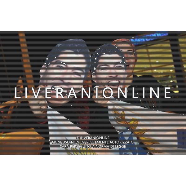 (140627) -- MONTEVIDEO, June 27, 2014 () -- Fans wait for the arrival of the Uruguay\'s National Team player, Luis Suarez in the Carrasco National Airport in Montevideo, capital of Uruguay on June 26, 2014. The Uruguay forward was banned by FIFA from all football for four months on Thursday for biting an Italian opponent in the first round match of 2014 FIFA World Cup. Uruguay will face Colombia on June 28, in FIFA World Cup Brazil 2014. (/Nicolas Celaya) ©PHOTOSHOT/Agenzia Aldo Liverani sas - ITALY ONLY - EDITORIAL USE ONLY - LUIS SUAREZ attaccante dell\'Uruguay e\' stato squalificato dalla Fifa da tutto il calcio per quattro mesi dopo aver morso chiellini alla Coppa del Mondo FIFA 2014