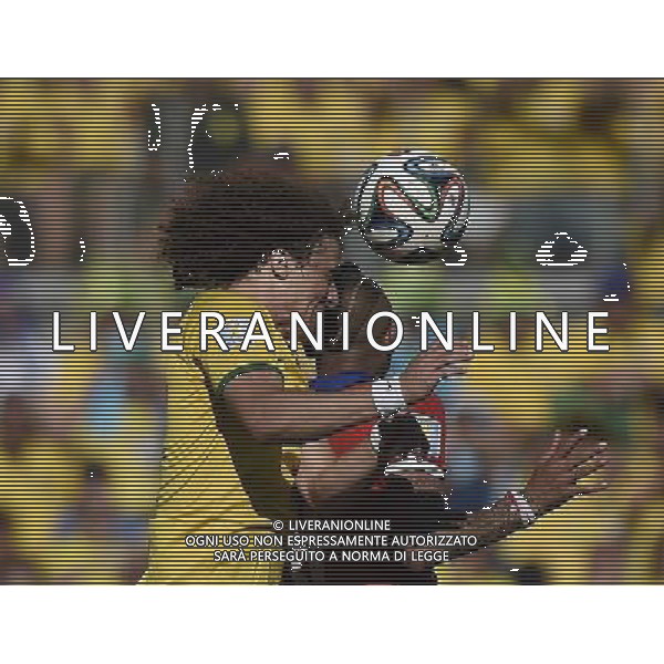 (140628) -- BELO HORIZONTE, June 28, 2014 () -- Brazil\'s David Luiz (L) vies with Chile\'s Arturo Vidal during a Round of 16 match between Brazil and Chile of 2014 FIFA World Cup at the Estadio Mineirao Stadium in Belo Horizonte, Brazil, on June 28, 2014. Brazil won 4-3 (3-2 in penalties) over Chile and qualified for Quarter-finals on Saturday. (/Qi Heng)(pcy) ©PHOTOSHOT/Agenzia Aldo Liverani sas - ITALY ONLY - EDITORIAL USE ONLY - Brasile Vs Cile Coppa del Mondo di calcio Fifa 2014 28 giugno 2014. Brasile ha vinto 4-3 (3-2 ai calci di rigore) e si qualifica per Quarti di finale