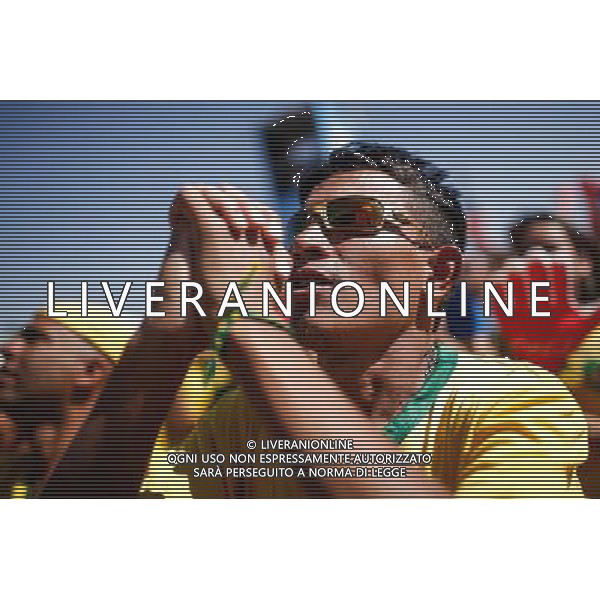 (140628) -- BRASILIA, June 28, 2014 () -- A Brazil\'s fan reacts while watching the broadcast of a Round of 16 match between Brazil and Chile at the FIFA Fan Fest in Brasilia, Brazil, on June 28, 2014. Brazil won 4-3 (3-2 in penalties) over Chile and qualified for Quarter-finals on Saturday. (/Jhon Paz) ©PHOTOSHOT/Agenzia Aldo Liverani sas - ITALY ONLY - EDITORIAL USE ONLY - Brasile Vs Cile Coppa del Mondo di calcio Fifa 2014 28 giugno 2014. Brasile ha vinto 4-3 (3-2 ai calci di rigore) e si qualifica per Quarti di finale