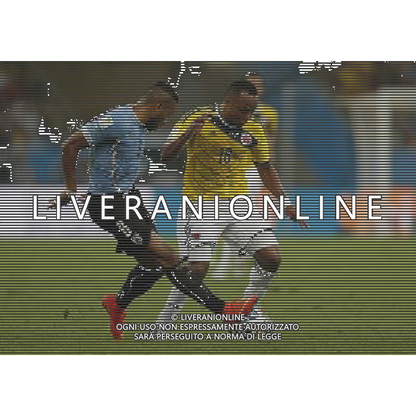 (140628) -- RIO DE JANEIRO, June 28, 2014 () -- Colombia\'s Juan Zuniga (R) vies with Uruguay\'s Alvaro Pereira during a Round of 16 match between Colombia and Uruguay of 2014 FIFA World Cup at the Estadio do Maracana Stadium in Rio de Janeiro, Brazil, on June 28, 2014.(/Wang Lili)(pcy) ©PHOTOSHOT/Agenzia Aldo Liverani sas - ITALY ONLY - EDITORIAL USE ONLY - Uruguay vs Colombia Coppa del Mondo FIFA 2014 Estadio do Stadio Maracana\' di Rio de Janeiro, in Brasile, il 28 giugno 2014. La Colombia ha vinto per 2-0 contro l\'Uruguay e si qualifica per Quarti di finale