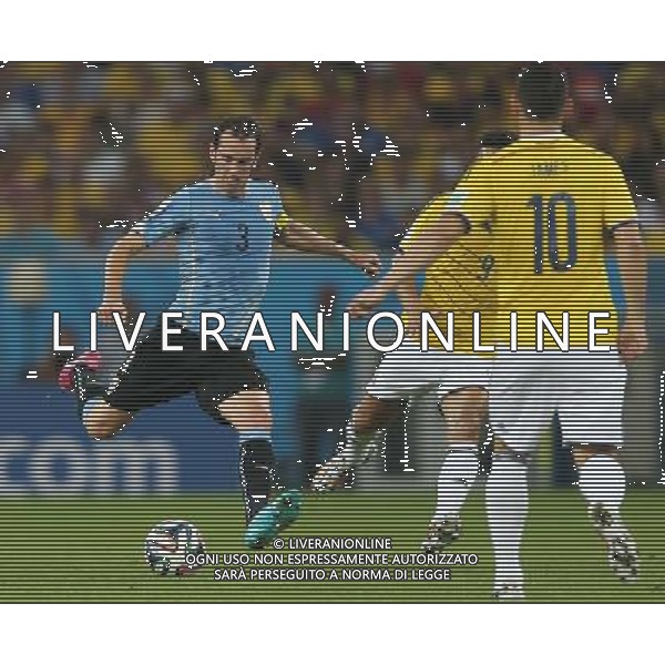 (140628) -- RIO DE JANEIRO, June 28, 2014 () -- Uruguay\'s Diego Godin passes the ball during a Round of 16 match between Colombia and Uruguay of 2014 FIFA World Cup at the Estadio do Maracana Stadium in Rio de Janeiro, Brazil, on June 28, 2014.(/Xu Zijian)(rh) ©PHOTOSHOT/Agenzia Aldo Liverani sas - ITALY ONLY - EDITORIAL USE ONLY - Uruguay vs Colombia Coppa del Mondo FIFA 2014 Estadio do Stadio Maracana\' di Rio de Janeiro, in Brasile, il 28 giugno 2014. La Colombia ha vinto per 2-0 contro l\'Uruguay e si qualifica per Quarti di finale