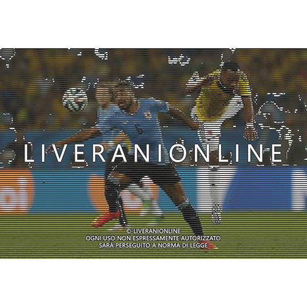 (140628) -- RIO DE JANEIRO, June 28, 2014 () -- Colombia\'s Juan Zuniga (R) vies with Uruguay\'s Alvaro Pereira during a Round of 16 match between Colombia and Uruguay of 2014 FIFA World Cup at the Estadio do Maracana Stadium in Rio de Janeiro, Brazil, on June 28, 2014.(/Wang Lili)(pcy) ©PHOTOSHOT/Agenzia Aldo Liverani sas - ITALY ONLY - EDITORIAL USE ONLY - Uruguay vs Colombia Coppa del Mondo FIFA 2014 Estadio do Stadio Maracana\' di Rio de Janeiro, in Brasile, il 28 giugno 2014. La Colombia ha vinto per 2-0 contro l\'Uruguay e si qualifica per Quarti di finale