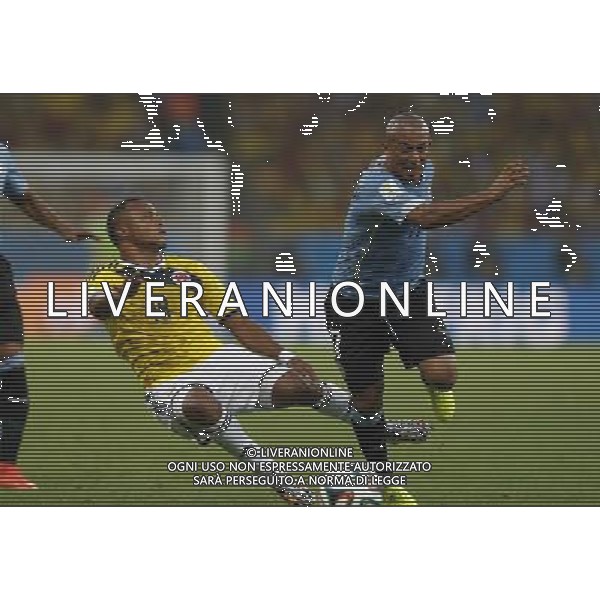 (140628) -- RIO DE JANEIRO, June 28, 2014 () -- Colombia\'s Juan Zuniga (L) vies with Uruguay\'s Egidio Arevalo Rios during a Round of 16 match between Colombia and Uruguay of 2014 FIFA World Cup at the Estadio do Maracana Stadium in Rio de Janeiro, Brazil, on June 28, 2014.(/Wang Lili)(pcy) ©PHOTOSHOT/Agenzia Aldo Liverani sas - ITALY ONLY - EDITORIAL USE ONLY - Uruguay vs Colombia Coppa del Mondo FIFA 2014 Estadio do Stadio Maracana\' di Rio de Janeiro, in Brasile, il 28 giugno 2014. La Colombia ha vinto per 2-0 contro l\'Uruguay e si qualifica per Quarti di finale