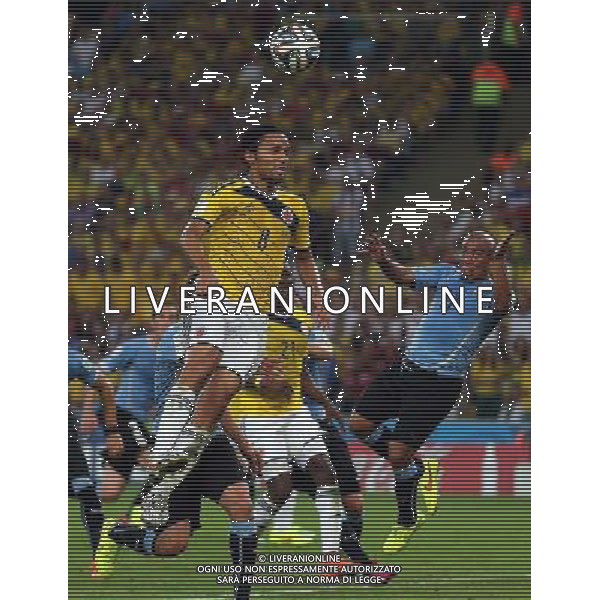 (140628) -- RIO DE JANEIRO, June 28, 2014 () -- Colombia\'s Abel Aguilar (up) jumps for a header during a Round of 16 match between Colombia and Uruguay of 2014 FIFA World Cup at the Estadio do Maracana Stadium in Rio de Janeiro, Brazil, on June 28, 2014. Colombia won 2-0 over Uruguay on Saturday. (/Xu Zijian)(rh) AG ALDO LIVERANI SAS ONLY ITALY