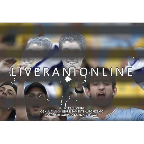 (140628) -- RIO DE JANEIRO, June 28, 2014 () -- Supporters of Uruguay holding masks of Uruguay\'s Luis Suarez cheer before a Round of 16 match between Colombia and Uruguay of 2014 FIFA World Cup at the Estadio do Maracana Stadium in Rio de Janeiro, Brazil, on June 28, 2014.(/Wang Lili)(pcy) AG ALDO LIVERANI SAS ONLY ITALY