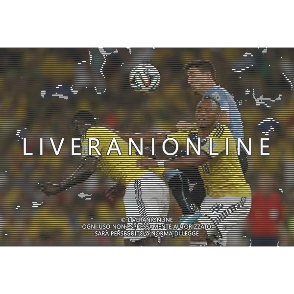 (140628) -- RIO DE JANEIRO, June 28, 2014 () -- Uruguay\'s Cristian Rodriguez (back) competes for a header with Colombia\'s Cristian Zapata (L, front) and Juan Zuniga during a Round of 16 match between Colombia and Uruguay of 2014 FIFA World Cup at the Estadio do Maracana Stadium in Rio de Janeiro, Brazil, on June 28, 2014.(/Wang Lili)(pcy) AG ALDO LIVERANI SAS ONLY ITALY