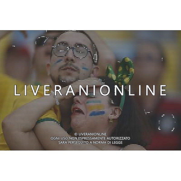 (140628) -- RIO DE JANEIRO, June 28, 2014 () -- Football fans react while watching a televised match of Round of 16 between Brazil and Chile of 2014 FIFA World Cup at the Estadio do Maracana Stadium in Rio de Janeiro, Brazil, ahead of another one between Colombia and Uruguay, on June 28, 2014. Brazil won 4-3 (3-2 in penalties) over Chile and qualified for Quarter-finals on Saturday. (/Wang Lili)(pcy) AG ALDO LIVERANI SAS ONLY ITALY