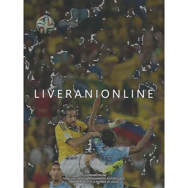 (140628) -- RIO DE JANEIRO, June 28, 2014 () -- Colombia\'s Mario Yepes (L) jumps for the ball during a Round of 16 match between Colombia and Uruguay of 2014 FIFA World Cup at the Estadio do Maracana Stadium in Rio de Janeiro, Brazil, on June 28, 2014. Colombia won 2-0 over Uruguay on Saturday. (/Xu Zijian)(rh) AG ALDO LIVERANI SAS ONLY ITALY