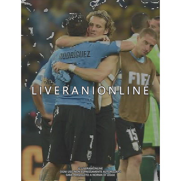 (140628) -- RIO DE JANEIRO, June 28, 2014 () -- Uruguay\'s Cristian Rodriguez (No.7) hugs Diego Forlan after a Round of 16 match between Colombia and Uruguay of 2014 FIFA World Cup at the Estadio do Maracana Stadium in Rio de Janeiro, Brazil, on June 28, 2014. Colombia won 2-0 over Uruguay on Saturday. (/Wang Yuguo)(rh) AG ALDO LIVERANI SAS ONLY ITALY