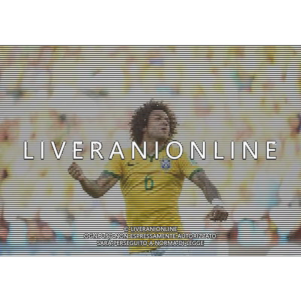 (140628) -- BELO HORIZONTE, June 28, 2014 () -- Brazil\'s Marcelo celebrates a penalty goal during the penalty shoot-out of a Round of 16 match between Brazil and Chile of 2014 FIFA World Cup at the Estadio Mineirao Stadium in Belo Horizonte, Brazil, on June 28, 2014. Brazil won 4-3 (3-2 in penalties) over Chile and qualified for Quarter-finals on Saturday.(/Liu Dawei)(rh) AG ALDO LIVERANI SAS ONLY ITALY