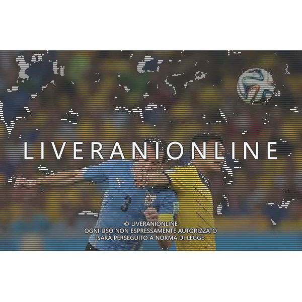 (140628) -- RIO DE JANEIRO, June 28, 2014 () -- Uruguay\'s Diego Godin jumps for a header during a Round of 16 match between Colombia and Uruguay of 2014 FIFA World Cup at the Estadio do Maracana Stadium in Rio de Janeiro, Brazil, on June 28, 2014.(/Xu Zijian)(rh) AG ALDO LIVERANI SAS ONLY ITALY