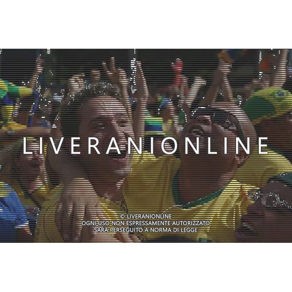 (140628) -- SAO PAULO, June 28, 2014 () -- Supporters of Brazil react while watching a televised Round of 16 match between Brazil and Chile of 2014 FIFA World Cup in Sao Paulo, Brazil, on June 28, 2014. Brazil won 4-3 (3-2 in penalties) over Chile and qualified for Quarter-finals on Saturday. (/Rahel Patrasso)(pcy) ©PHOTOSHOT/Agenzia Aldo Liverani sas - ITALY ONLY - EDITORIAL USE ONLY - Brasile Vs Cile Coppa del Mondo di calcio Fifa 2014 28 giugno 2014. Brasile ha vinto 4-3 (3-2 ai calci di rigore) e si qualifica per Quarti di finale