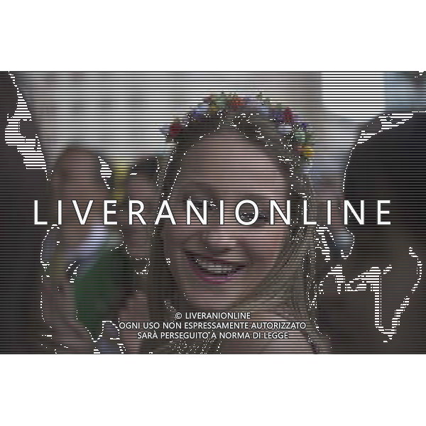 (140630) --PORTO ALEGRE, June 30, 2014 () -- A supporter of Germany is seen while waiting to watch a Round of 16 match between Germany and Algeria of 2014 FIFA World Cup, in downtown Porto Alegre, Brazil, on June 30, 2014. (/Guillermo Arias)(pcy) ©photoshot/Agenzia Aldo Liverani sas - ITALY ONLY - EDITORIAL USE ONLY - Germania Vs Algeria Coppa del Mondo FIFA World Cup presso l\'Estadio Stadio Beira-Rio di Porto Alegre, in Brasile, il 30 giugno 2014