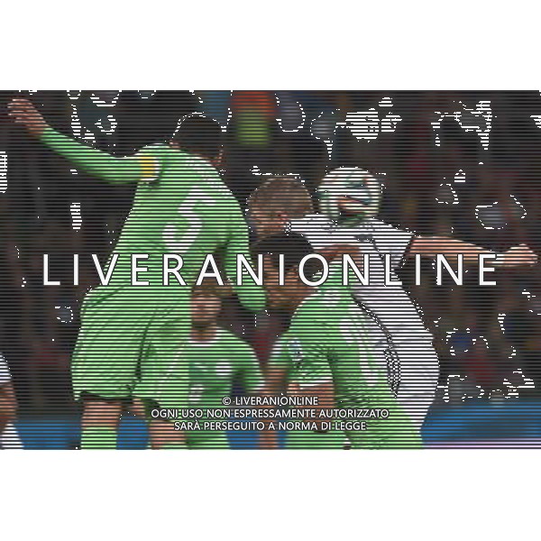 (140630) -- PORTO ALEGRE, June 30, 2014 () -- Germany\'s Bastian Schweinsteiger (R) vies with Algeria\'s Aissa Mandi (C) and Rafik Halliche (L) during a Round of 16 match between Germany and Algeria of 2014 FIFA World Cup at the Estadio Beira-Rio Stadium in Porto Alegre, Brazil, on June 30, 2014. (/Li Ga)(pcy) ©photoshot/Agenzia Aldo Liverani sas - ITALY ONLY - EDITORIAL USE ONLY - Germania Vs Algeria Coppa del Mondo FIFA World Cup presso l\'Estadio Stadio Beira-Rio di Porto Alegre, in Brasile, il 30 giugno 2014