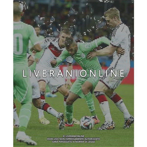 (140630) -- PORTO ALEGRE, June 30, 2014 () -- Germany\'s Bastian Schweinsteiger (2nd L) vies with Algeria\'s Islam Slimani (2nd R) during a Round of 16 match between Germany and Algeria of 2014 FIFA World Cup at the Estadio Beira-Rio Stadium in Porto Alegre, Brazil, on June 30, 2014. (/Chen Jianli)(rh) ©photoshot/Agenzia Aldo Liverani sas - ITALY ONLY - EDITORIAL USE ONLY - Germania Vs Algeria Coppa del Mondo FIFA World Cup presso l\'Estadio Stadio Beira-Rio di Porto Alegre, in Brasile, il 30 giugno 2014