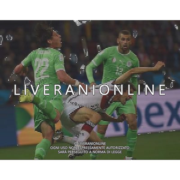 (140630) -- PORTO ALEGRE, June 30, 2014 () -- Germany\'s Thomas Muller (C) vies with Algeria\'s Mehdi Mostefa (L) during a Round of 16 match between Germany and Algeria of 2014 FIFA World Cup at the Estadio Beira-Rio Stadium in Porto Alegre, Brazil, on June 30, 2014. (/Li Ga)(pcy) ©photoshot/Agenzia Aldo Liverani sas - ITALY ONLY - EDITORIAL USE ONLY - Germania Vs Algeria Coppa del Mondo FIFA World Cup presso l\'Estadio Stadio Beira-Rio di Porto Alegre, in Brasile, il 30 giugno 2014