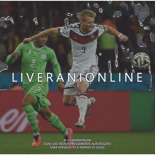 (140630) -- PORTO ALEGRE, June 30, 2014 () -- Germany\'s Andre Schurrle (R) vies with Algeria\'s Faouzi Ghoualm during a Round of 16 match between Germany and Algeria of 2014 FIFA World Cup at the Estadio Beira-Rio Stadium in Porto Alegre, Brazil, on June 30, 2014. (/Li Ga)(pcy) ©photoshot/Agenzia Aldo Liverani sas - ITALY ONLY - EDITORIAL USE ONLY - Germania Vs Algeria Coppa del Mondo FIFA World Cup presso l\'Estadio Stadio Beira-Rio di Porto Alegre, in Brasile, il 30 giugno 2014