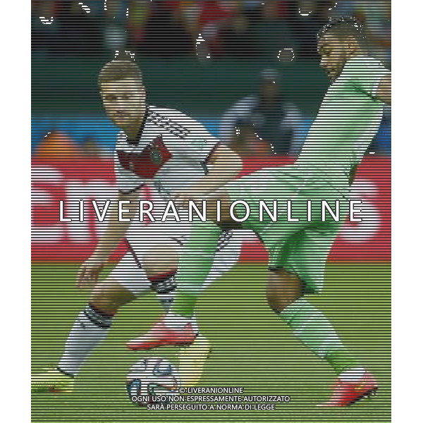 (140630) -- PORTO ALEGRE, June 30, 2014 () -- Germany\'s Shkodran Mustafi vies with Algeria\'s Hilal Soudani during a Round of 16 match between Germany and Algeria of 2014 FIFA World Cup at the Estadio Beira-Rio Stadium in Porto Alegre, Brazil, on June 30, 2014. (/Chen Jianli)(rh) ©photoshot/Agenzia Aldo Liverani sas - ITALY ONLY - EDITORIAL USE ONLY - Germania Vs Algeria Coppa del Mondo FIFA World Cup presso l\'Estadio Stadio Beira-Rio di Porto Alegre, in Brasile, il 30 giugno 2014
