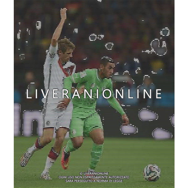 (140630) -- PORTO ALEGRE, June 30, 2014 () -- Algeria\'s Faouzi Ghoualm (R) vies with Germany\'s Thomas Muller during a Round of 16 match between Germany and Algeria of 2014 FIFA World Cup at the Estadio Beira-Rio Stadium in Porto Alegre, Brazil, on June 30, 2014. (/Li Ga)(pcy) ©photoshot/Agenzia Aldo Liverani sas - ITALY ONLY - EDITORIAL USE ONLY - Germania Vs Algeria Coppa del Mondo FIFA World Cup presso l\'Estadio Stadio Beira-Rio di Porto Alegre, in Brasile, il 30 giugno 2014