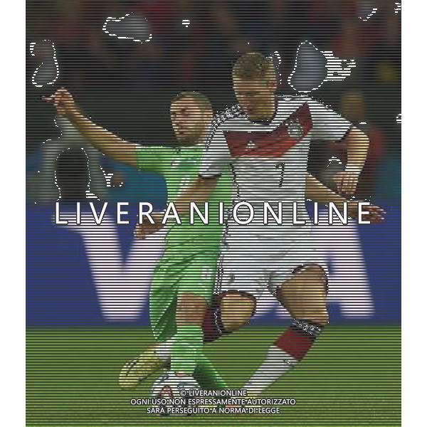 (140630) -- PORTO ALEGRE, June 30, 2014 () -- Germany\'s Bastian Schweinsteiger (R) vies with Algeria\'s Medhi Lacen during a Round of 16 match between Germany and Algeria of 2014 FIFA World Cup at the Estadio Beira-Rio Stadium in Porto Alegre, Brazil, on June 30, 2014. (/Li Ga)(pcy) ©photoshot/Agenzia Aldo Liverani sas - ITALY ONLY - EDITORIAL USE ONLY - Germania Vs Algeria Coppa del Mondo FIFA World Cup presso l\'Estadio Stadio Beira-Rio di Porto Alegre, in Brasile, il 30 giugno 2014
