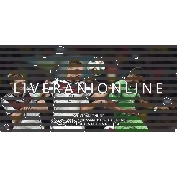 (140630) -- PORTO ALEGRE, June 30, 2014 () -- Germany\'s Shkodran Mustafi (2nd L) competes for a header during a Round of 16 match between Germany and Algeria of 2014 FIFA World Cup at the Estadio Beira-Rio Stadium in Porto Alegre, Brazil, on June 30, 2014. (/Li Ga)(pcy) ©photoshot/Agenzia Aldo Liverani sas - ITALY ONLY - EDITORIAL USE ONLY - Germania Vs Algeria Coppa del Mondo FIFA World Cup presso l\'Estadio Stadio Beira-Rio di Porto Alegre, in Brasile, il 30 giugno 2014