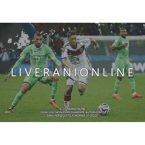 (140630) -- PORTO ALEGRE, June 30, 2014 () -- Germany\'s Mesut Ozil vies with Algeria\'s Islam Slimani during a Round of 16 match between Germany and Algeria of 2014 FIFA World Cup at the Estadio Beira-Rio Stadium in Porto Alegre, Brazil, on June 30, 2014. (/Chen Jianli)(rh) ©photoshot/Agenzia Aldo Liverani sas - ITALY ONLY - EDITORIAL USE ONLY - Germania Vs Algeria Coppa del Mondo FIFA World Cup presso l\'Estadio Stadio Beira-Rio di Porto Alegre, in Brasile, il 30 giugno 2014