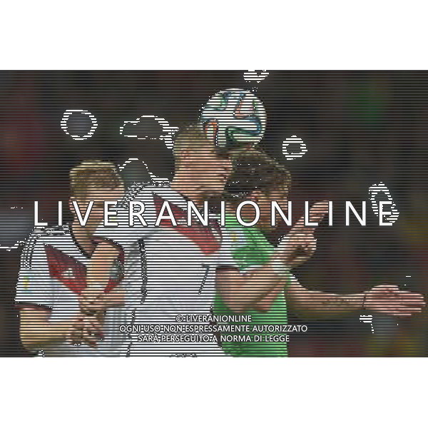 (140630) -- PORTO ALEGRE, June 30, 2014 () -- Germany\'s Bastian Schweinsteiger (C) heads the ball during a Round of 16 match between Germany and Algeria of 2014 FIFA World Cup at the Estadio Beira-Rio Stadium in Porto Alegre, Brazil, on June 30, 2014. (/Li Ga)(pcy) ©photoshot/Agenzia Aldo Liverani sas - ITALY ONLY - EDITORIAL USE ONLY - Germania Vs Algeria Coppa del Mondo FIFA World Cup presso l\'Estadio Stadio Beira-Rio di Porto Alegre, in Brasile, il 30 giugno 2014