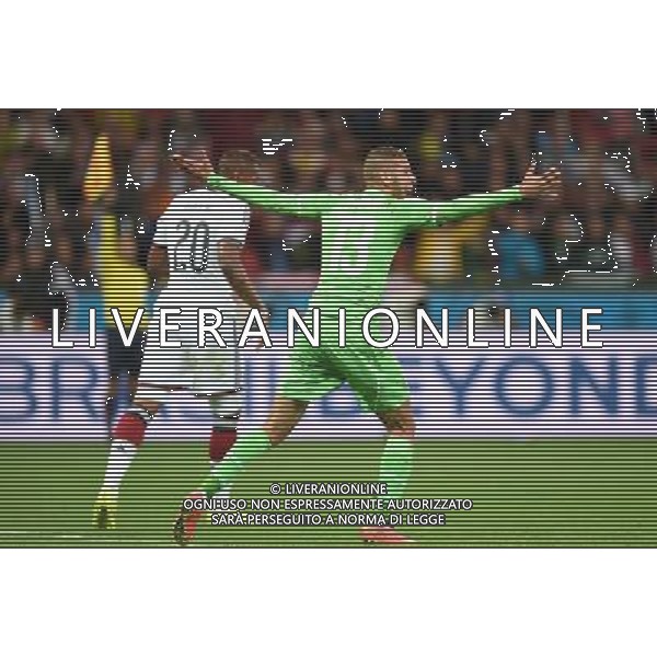 (140630) -- PORTO ALEGRE, June 30, 2014 () -- Algeria\'s Islam Slimani (front) reacts during a Round of 16 match between Germany and Algeria of 2014 FIFA World Cup at the Estadio Beira-Rio Stadium in Porto Alegre, Brazil, on June 30, 2014. (/Li Ga)(pcy) ©photoshot/Agenzia Aldo Liverani sas - ITALY ONLY - EDITORIAL USE ONLY - Germania Vs Algeria Coppa del Mondo FIFA World Cup presso l\'Estadio Stadio Beira-Rio di Porto Alegre, in Brasile, il 30 giugno 2014